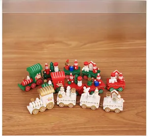 Detail of wooden Christmas train set with miniature figurines in red green and white