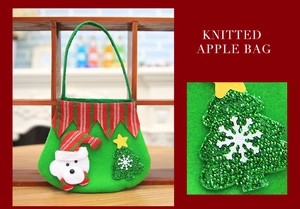 Detail of Christmas green felt bag featuring a 3D polar bear and sequin tree design
