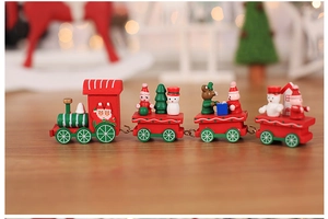 Detail of wooden Christmas train toy with snowman, tree figures and metal hooks