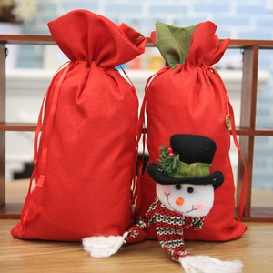 Festive Christmas candy drawstring gift bags with cute 3D snowman and bell decorations