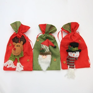 Three-piece Christmas drawstring gift bags featuring Santa, reindeer, and snowman designs