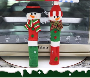 Detailed view of plush snowman microwave handle covers with festive 3D scarf and hat