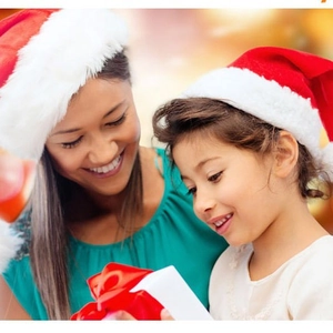 Classic red plush Santa hats for adults and children in a warm family holiday gift setting