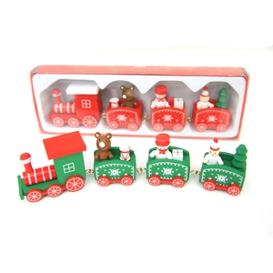 Classic wooden Christmas train set with festive figurines on white background