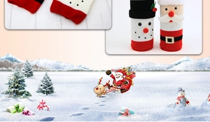 Detail of Christmas knitted wine bottle covers with snowman and Santa Claus designs