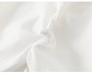 Macro shot of high-quality white cotton fabric texture with soft ruffle detailing