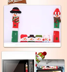 Detail of Christmas microwave handle covers with snowman design on red and white fabric