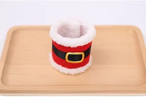 Detail of Christmas napkin ring made of brushed fabric with Santa belt buckle design