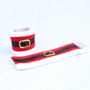 Detail of red Santa style napkin rings with white faux fur edges and gold buckles