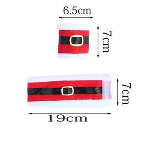 Detailed view of Santa suit style napkin rings with red plush fabric and golden buckle