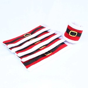 Detail of Christmas chair leg covers featuring red velvet and festive belt buckles