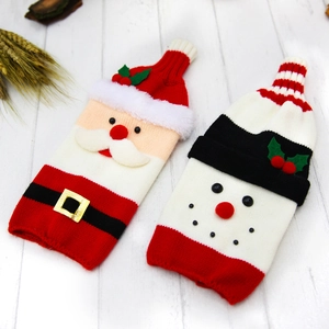 Knitted Christmas wine bottle covers featuring Santa Claus and snowman festive designs