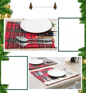 Vue détaillée du set de table de Noël à carreaux rouges avec broderie de renne et pins