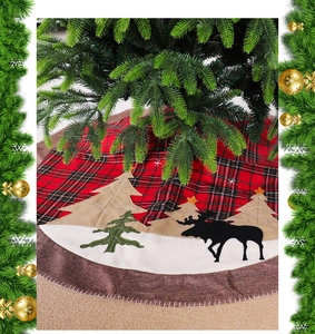 Detail of red plaid Christmas tree skirt with elk and pine tree felt applique motifs