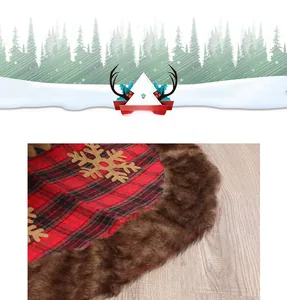 Detail of red and black buffalo plaid Christmas tree skirt with plush trim and golden snowflakes