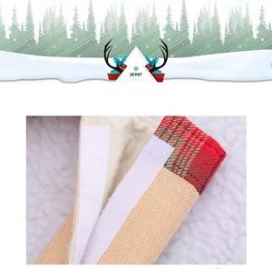 Detail of Christmas handle cover showing Velcro closure and plaid trim on linen fabric