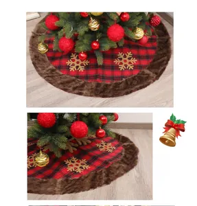 Detail of red black plaid Christmas tree skirt with faux fur edge and golden snowflakes