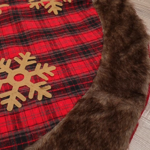 Christmas tree skirt with red buffalo plaid pattern and brown faux fur border trim