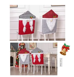 Detail of Christmas gnome chair covers in red and black plaid with plush faux beard