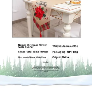 Detail of Christmas table runner with red flower, tassels and Merry Christmas text