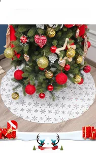 Detail of white plush Christmas tree skirt with iridescent snowflake sequins decor