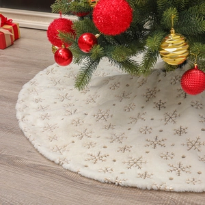 White plush Christmas tree skirt with gold sequined snowflake embroidery and warm decor