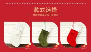 Detailed knitted Christmas stockings with cable patterns and white pom-pom decorations