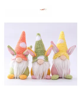 Detailed close-up of three colorful Easter gnome plush dolls with rabbit ears and soft textures