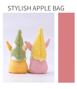 Detail of two Easter gnome plush dolls with colorful hats for holiday home decoration