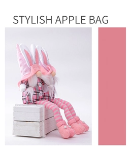 Detail of pink Easter gnome gift bags with long bunny ears and striped fabric texture