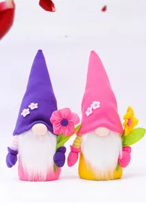 Detail of plush flower gnomes with soft fabric textures and delicate floral embroidery