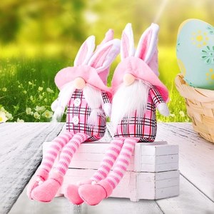 Easter gnome plush doll pair with bunny ears and plaid body on spring meadow background