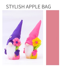 Close-up of handmade flower gnome plush set in purple and pink felt material