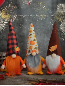 Three assorted harvest gnomes with pumpkin and maple leaf decorations on wood base