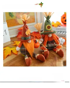 Detail of plush gnomes with orange beard, maple leaf hat, and mini broom decoration