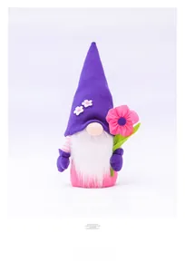 Detail of handmade flower gnome doll with purple felt hat and white plush beard ornaments