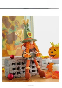 Detail of harvest gnome doll with sunflower hat, orange braids and a tiny straw broom