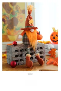 Detailed view of fall harvest gnome plush with orange pumpkin and maple leaf elements