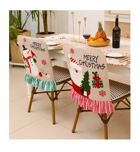 Detail of Christmas chair cover set with rustic linen texture and festive embroidery