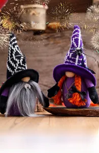 Close-up of Halloween gnomes with vampire fangs and spider pendant on rustic wood surface