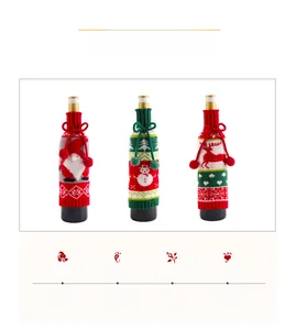 Close-up of knitted Christmas wine bottle covers with elk, santa, and snowman patterns