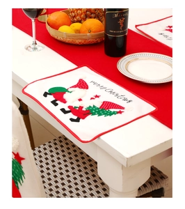 Detailed close-up of Christmas placemat with Santa embroidery and Merry Christmas text