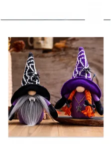 Close-up of Halloween gnome plush dolls with vampire bat and witch themed decorations