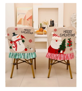 Detail of burlap Christmas chair covers with 3D embroidery and festive stripe frills