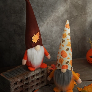 Fall harvest themed faceless gnome dolls featuring maple leaf hats and autumn decorations
