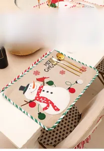 Linen Christmas placemat with snowman embroidery and festive MERRY CHRISTMAS lettering