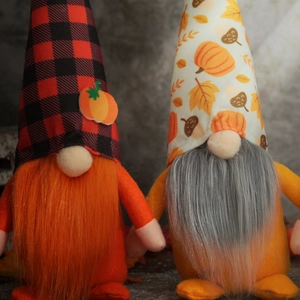 Harvest festival gnomes with pumpkin hats and orange beards for autumn table decor