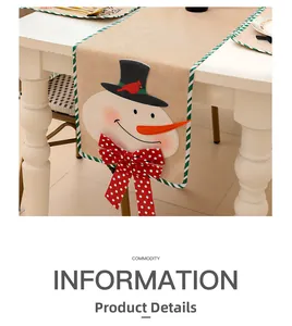 Detail of Christmas table runner with snowman embroidery on textured linen fabric