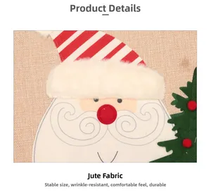 Close-up of burlap Christmas tree skirt showing detailed embroidery and Santa Claus patchwork