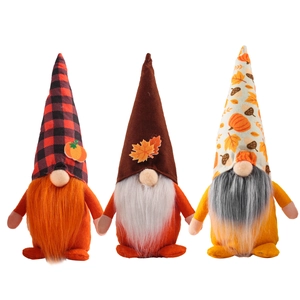 Set of three autumn harvest gnomes featuring pumpkin and maple leaf holiday decorations